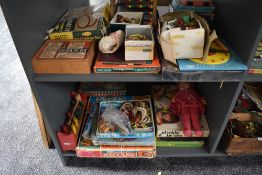 Two shelves of vintage toys and games including Plastic Meccano part set R6496, 84 piece plastic