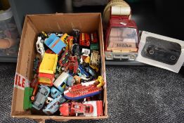 A selection of playworn diecast and tin plate vehicles including early Corgi, Dinky, Britains,
