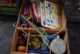 A selection of mixed vintage Meccano in wooden box containing brass cogs, nuts, parts etc