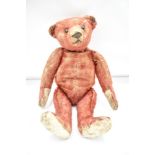 An original Steiff red mohair straw filled bear, possibly a smaller version of Alfonzo dating back