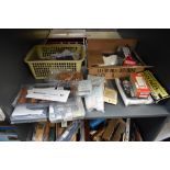 A shelf of 00/HO accessories including New Track, Springside, Hornby etc