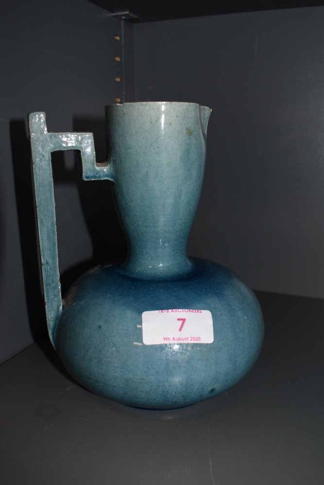 A early art deco design vase possibly attributed in style to Keith Murray with a blue glaze (AF) and