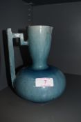 A early art deco design vase possibly attributed in style to Keith Murray with a blue glaze (AF) and