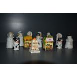 A selection of character styled salt, pepper and cruet sets including hand decorated and slipcast