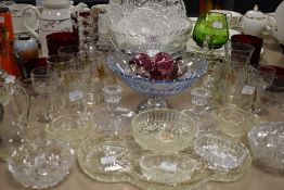 A selection of clear cut and crystal glass ware including hand blown sherry glasses with etched