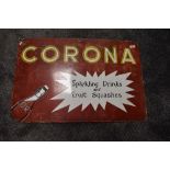 A vintage enamel advertising sign for Corona Sparkling drinks and fruit squashes