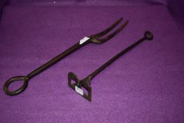 A vintage wrought iron branding iron for letter B and similar large fork