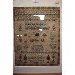 An intricate needle work sampler dated 1835 depicting alphabet with animal, plant characters and