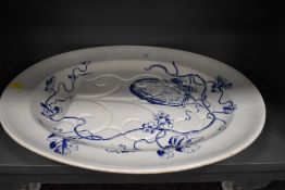 A large meat charger and draining dish bearing impressed marks to base and fig fruit design