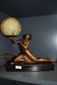 An Art Deco lamp with semi nude female figure and mottled glass dome with black marble base