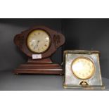A Swiss made clock with balloon style mahogany case and similar 8 day travel clock