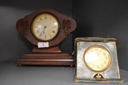 A Swiss made clock with balloon style mahogany case and similar 8 day travel clock