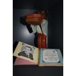 A vintage wooden character holding a tray and an Autograph book, film star interest and Morecambe