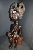 An Ethnic tribal fertility figure probably of African descent possibly Bangwa Anyi in hand carved