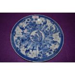 A Chinese export hard paste blue and white ware plate having multiple panels of blossom and lady