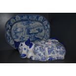 A blue and white ware ceramic charger and similar lidded cow dish