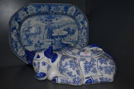 A blue and white ware ceramic charger and similar lidded cow dish
