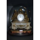 A 19th century domed mantle clock with ormelu decorated case, enamel face, dial and alabaster base