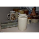 A collection of salt glazed stone ware, including jugs and pots and more.