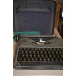 A portable typewriter by Empire The Aristocrat