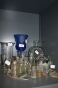 An interesting collection of vintage and antique glass bottles and similar including eyebath,