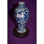 A Chinese export blue and white ware vase having detailed decoration of birds, butterfly and foliage