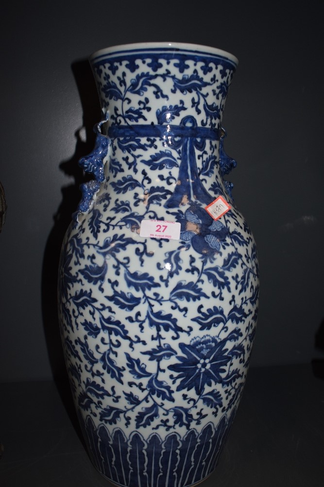 A large standing hard paste Chinese vase with traditional blue and white design