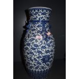 A large standing hard paste Chinese vase with traditional blue and white design