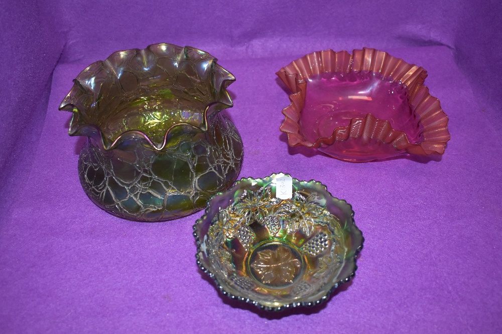 A selection of fine glass wares including Loetz iridescenct green bowl, similar bowl and cranberry