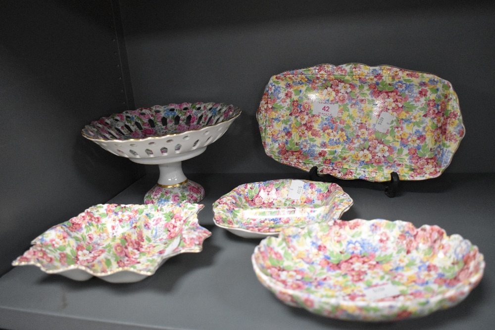 A selection of chintz ceramics including dressing table items and Crown Geisha tazza