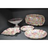 A selection of chintz ceramics including dressing table items and Crown Geisha tazza