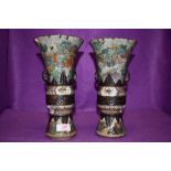 An impressive pair of Chinese export mantle vases in hard paste having extensive detailing of