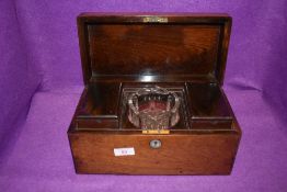 A mahogany veneer cased tea caddy or similar communion service set