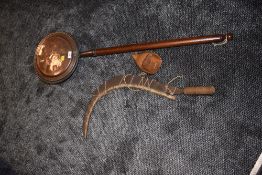 A vintage scythe having wooden handle, including hand guard and birch protective guard fitted to the