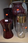 A selection of coloured glass vases and similar