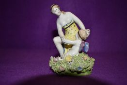 A 19th century antique Staffordshire ceramic figure base of maiden and angry cherub
