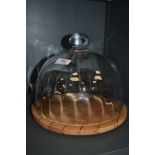 A lidded cheese dome with beech wood base by Dartington