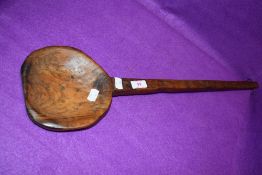 A large wooden farm house spoon possibly for cheese making