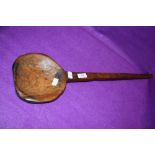 A large wooden farm house spoon possibly for cheese making