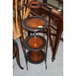 An early 20th Century mahogany cake stand, top handle broken