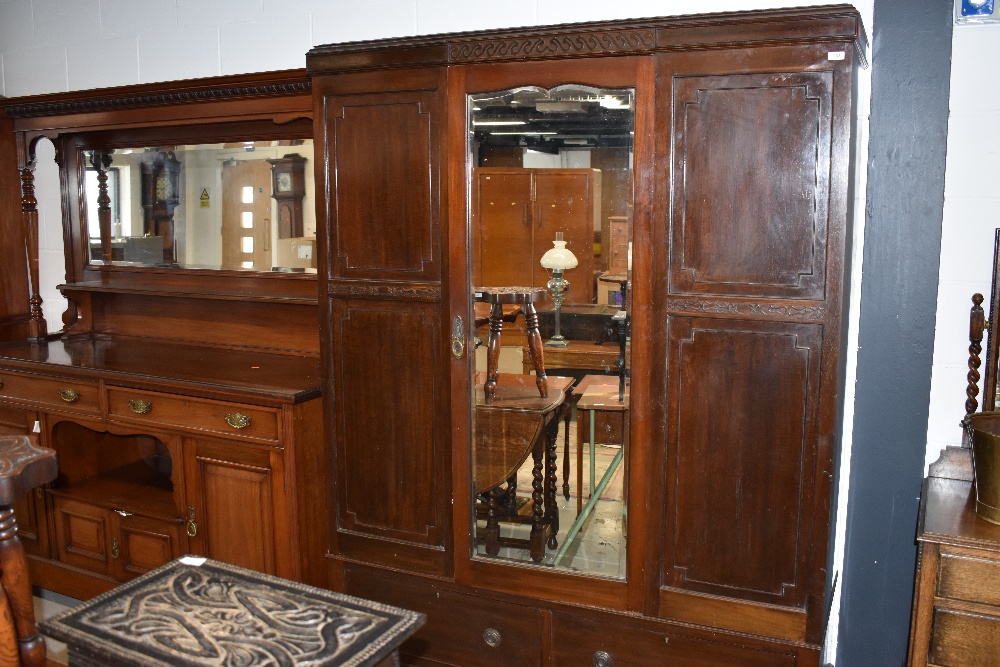 An early 20th Century mahogany mirror door wardrobe, approx dimensions W150cm H204cm D50cm