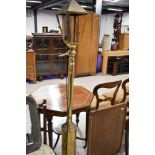 A vintage brass standard lamp, modelled as street lamp, approx. height 173cm