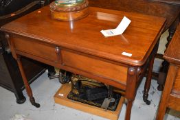 An early 20th Century mahogany side table , having decorative frieze section on turned legs and