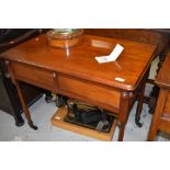 An early 20th Century mahogany side table , having decorative frieze section on turned legs and