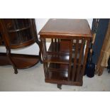 An Edwardian mahogany revolving bookcase having crossband inlay, approx. width 48cm