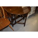 A nice quality traditional oak gate leg table, having bobbin turned legs, good proportions being