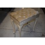 A vintage dressing table stool having dralon upholstery