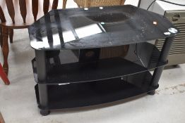 A glass TV stand, width approx. 80cm