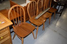 A set of four vintage , Ercol style (not labelled but stamped LE2056) , hoop and stick back