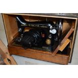 A vintage electric singer sewing machine, cased